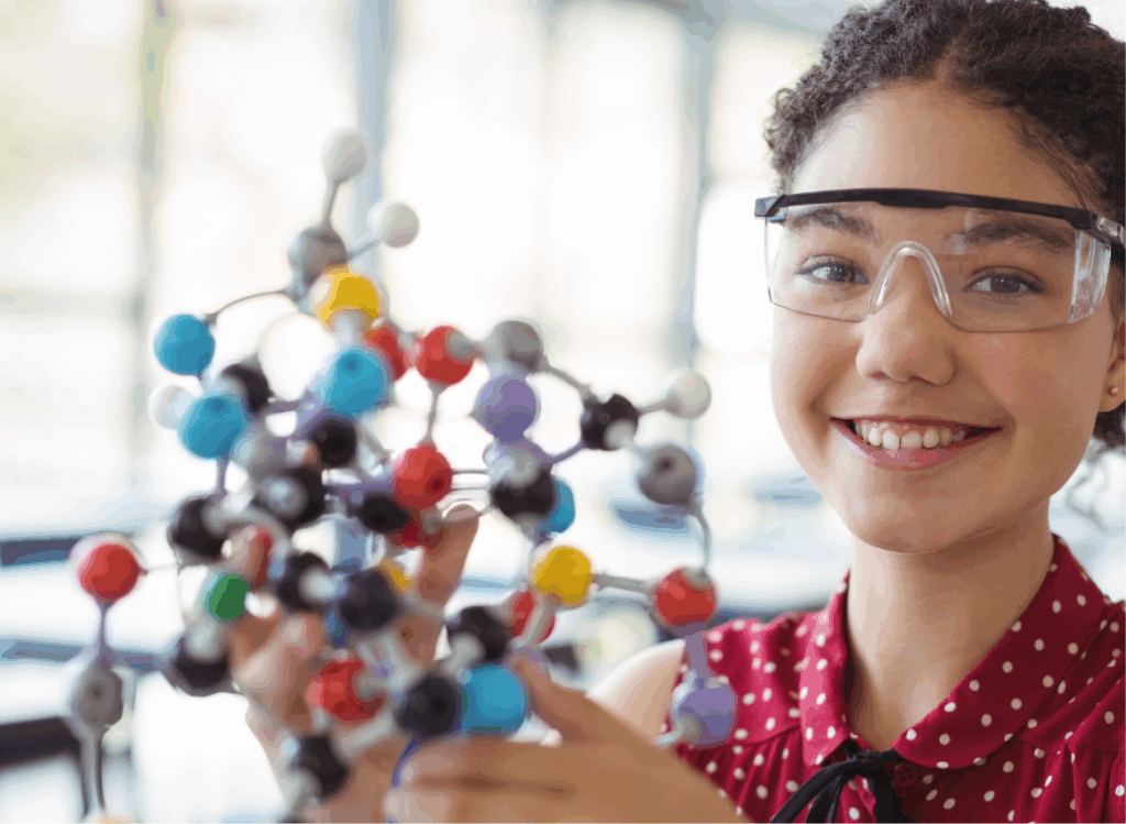 Girl holding science experiment.